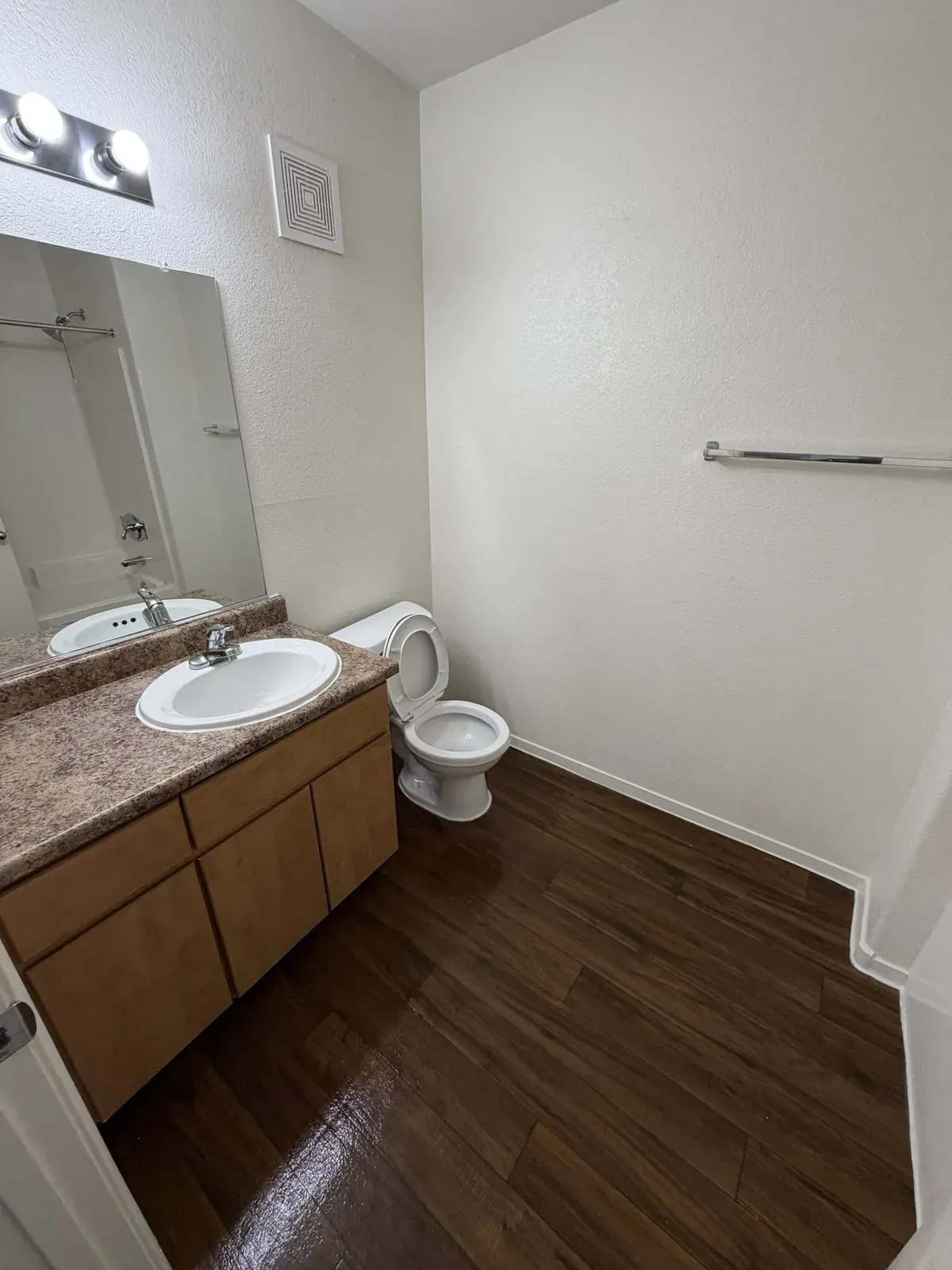 Apartment bathroom turnover cleaning — dual sink vanity and tub